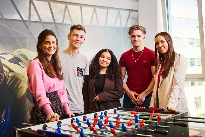 Colleagues playing table socces