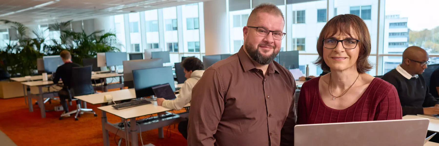 Eneco colleagues working behind laptops